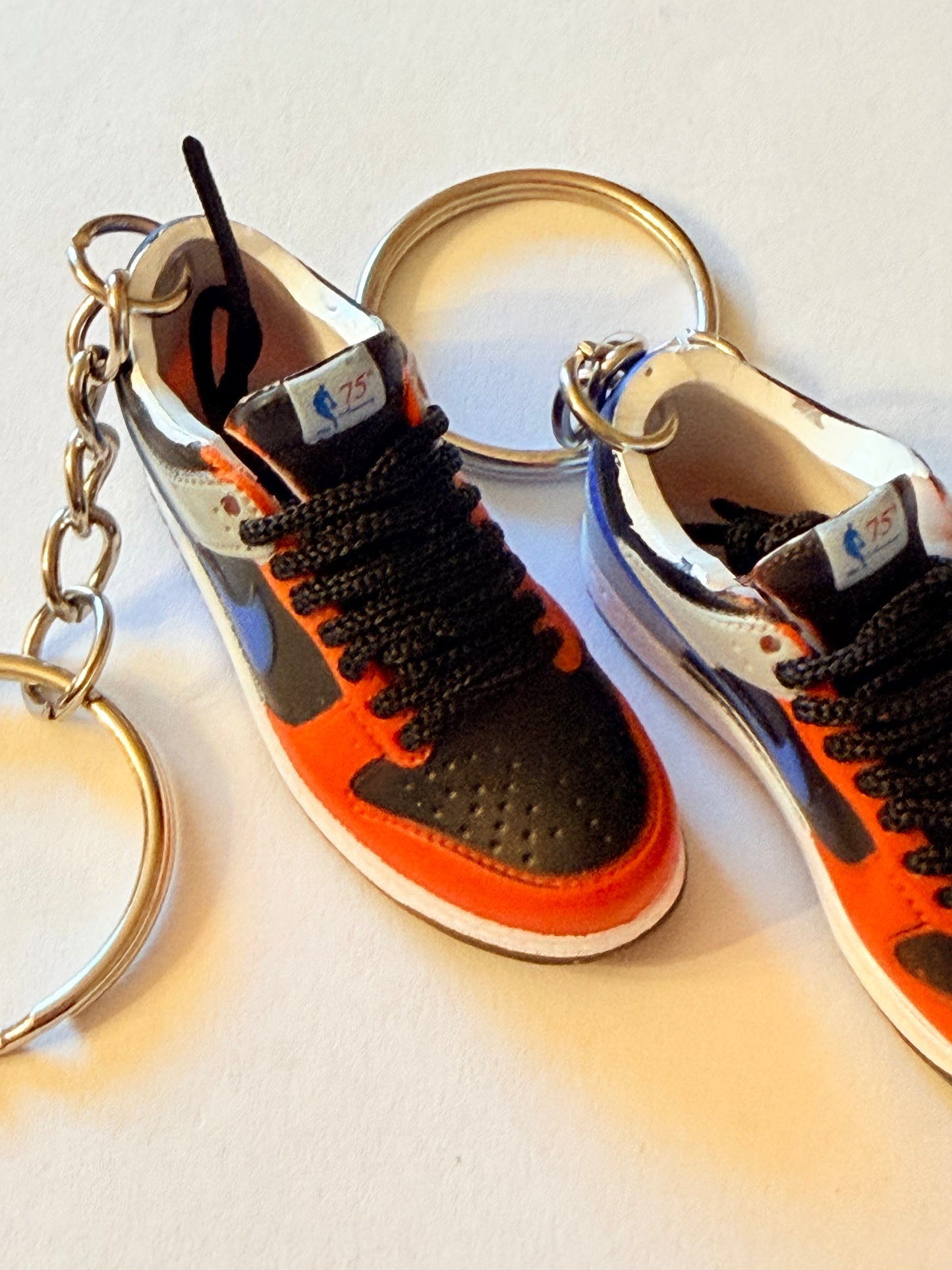 “Riot Edition Mini Sneaker Keychain Set – Red/Blue Colorway”